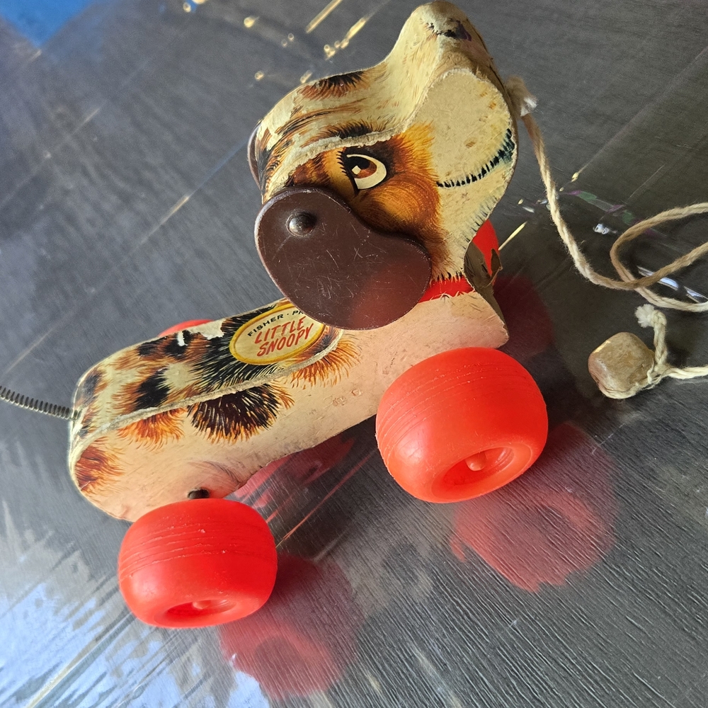 Vintage Little Snoopy Pull Toy with Red Wheels